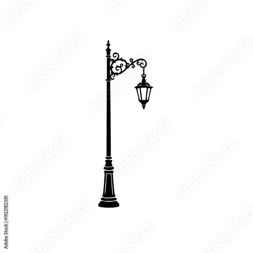 A vintage street lamp with intricate design and hanging lanterns.