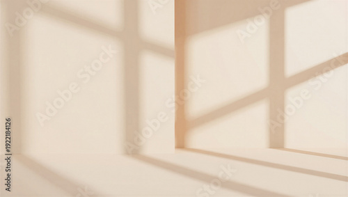 Fotografi Interior corner with soft window light casting shadow patterns on neutral walls