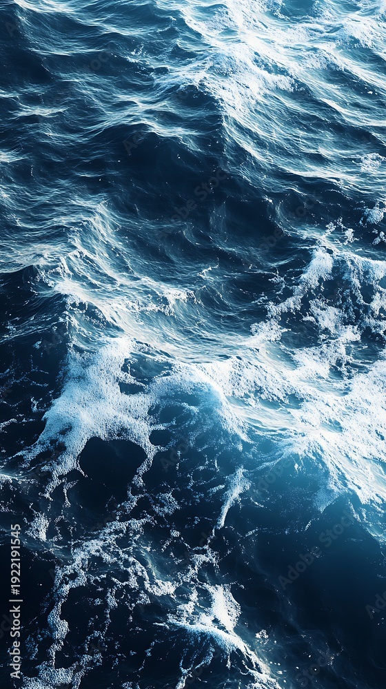 Fototapeta premium Turbulent ocean waves with white foam and blue water texture