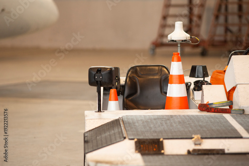 Billede på lærred Gulfstream G hangar safety cones staged, maintenance equipment arranged near air