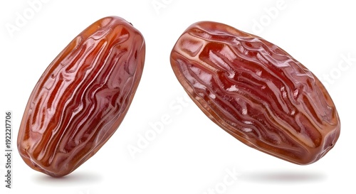 Two dried dates on a white background