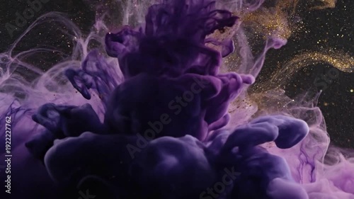 Abstract purple and magenta ink swirling in water