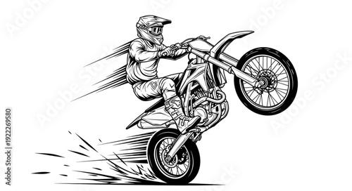 Motorcyclist performing a wheelie on a dirt bike.