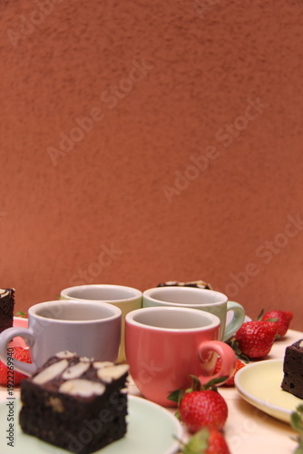 Vertical café dessert table with copy space, espresso, brownies and strawberries. Ideal for coffee ads, bakery promotions and social media graphics.