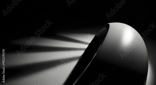A sleek curved object emits rays of light in a dark setting