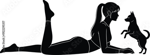 Black vector silhouette illustration of a young woman lying on her stomach on the floor playing with a small dog looking at her.