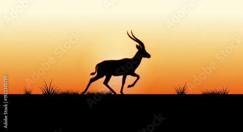 Antelope running in savannah at sunset with vibrant orange sky and silhouetted grass