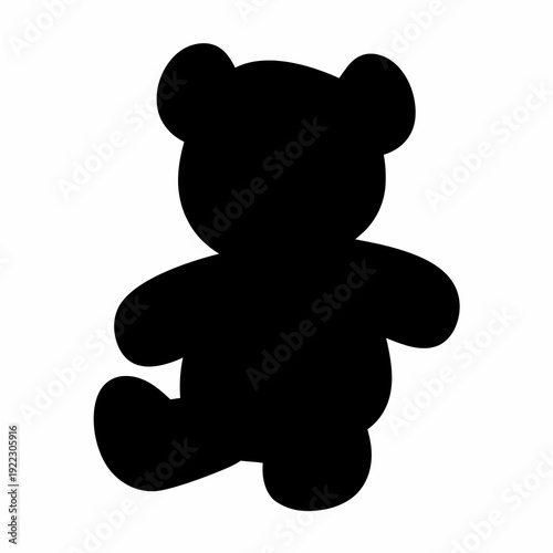 Dark silhouette of a teddy bear sitting on a white background