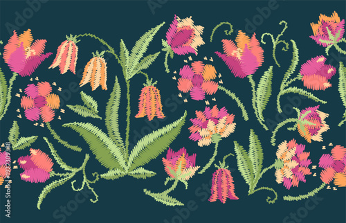 Beautiful seamless border with embroidered flowers. Decorative floral embroidery. Cute spring pattern.
