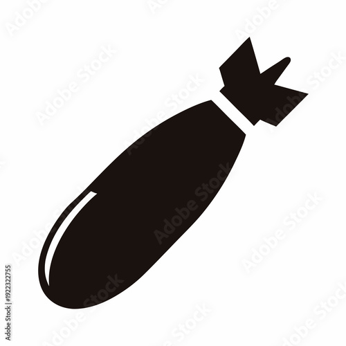 A black silhouette of an unexploded ordnance lying diagonally, bomb
