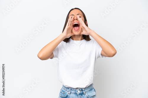 Young caucasian woman isolated on white background shouting and announcing something