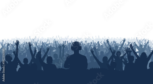 Large crowd cheering with raised hands at concert or event in dramatic blue lighting