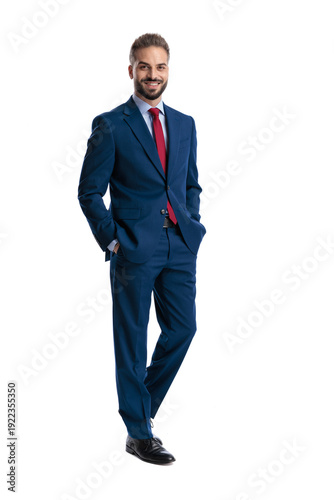 Successful businessman standing with hands in pockets