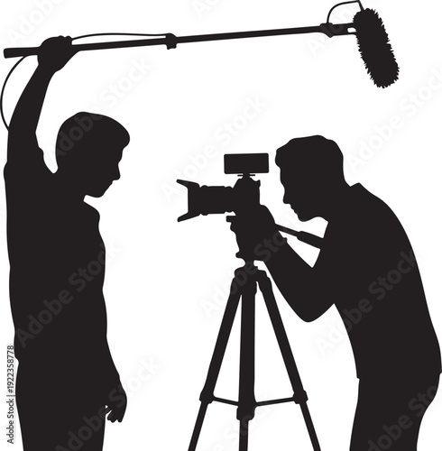 Silhouette of Cameraman and Boom Operator Filming a Scene