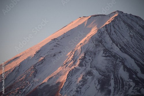 Konstfotografi Sunlit Snowy Summit of Mount Fuji at Dawn, Japan