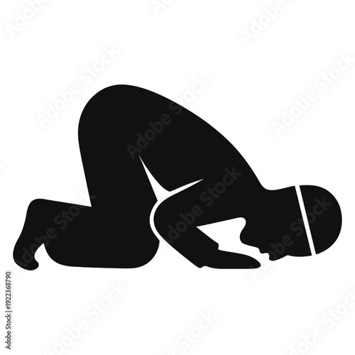 A person in a kneeling position with their head bowed in a moment of prayer or contemplation