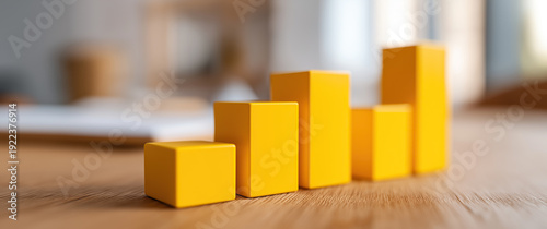 Wallpaper Mural Ascending yellow wooden blocks arranged as bar chart symbolizing business growth and financial success.
 Torontodigital.ca