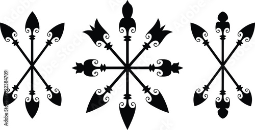 Three black ornamental spear arrangements forming symmetrical star patterns on a clean white backdrop