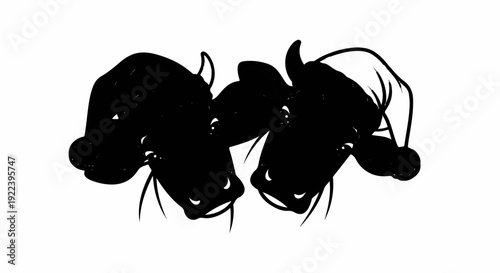 Two black cow heads drawn in a simple, silhouette style