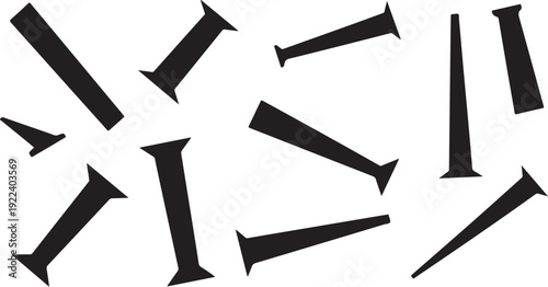 Black nails scattered on a white background randomly placed