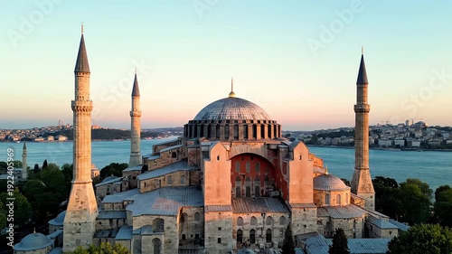 The Hagia Sophia, a historic mosque and former cathedral, stands majestically in Istanbul at sunset.