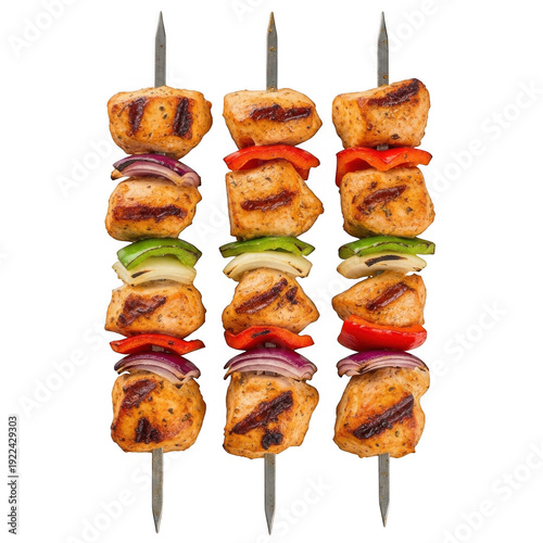 Grilled chicken and vegetable skewers on metal sticks, ready to eat.
