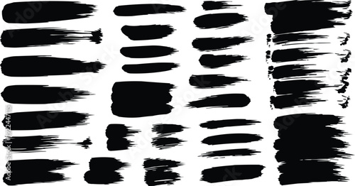 The image showcases a collection of black brush strokes that vary in length, thickness, and style, creating a visually dynamic composition.