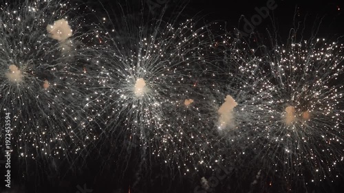 Amazing real beautiful colorful fireworks background on celebration night event for happy new year party or independence day, Abstract Multi color golden firework in the night sky