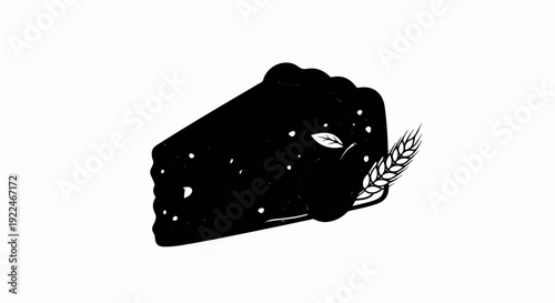 Slice of dark pie with seeds, a leaf, and wheat stalk