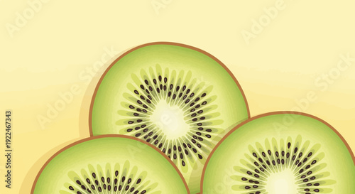 Sliced kiwi fruit arranged on a soft yellow background, revealing textures