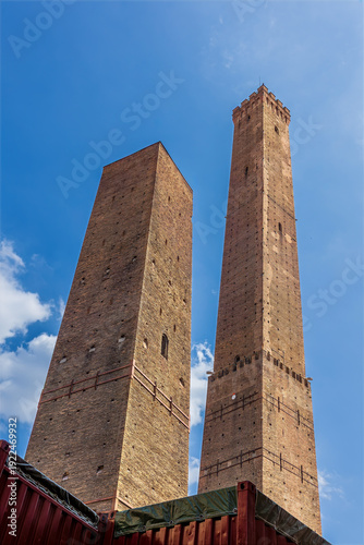 Wallpaper Mural The famous two towers are the symbol of Bologna. The Asinelli Tower (Torre degli Asinelli) is the taller tower on the right, and the Garisenda Tower (Torre Garisenda) is the shorter one. Torontodigital.ca