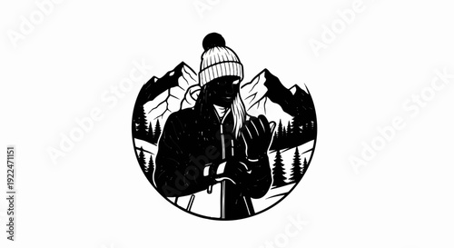 Silhouette of person in winter gear with mountainous backdrop