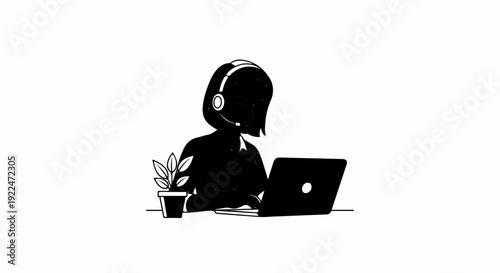 Silhouette of a person wearing a headset and working on a laptop