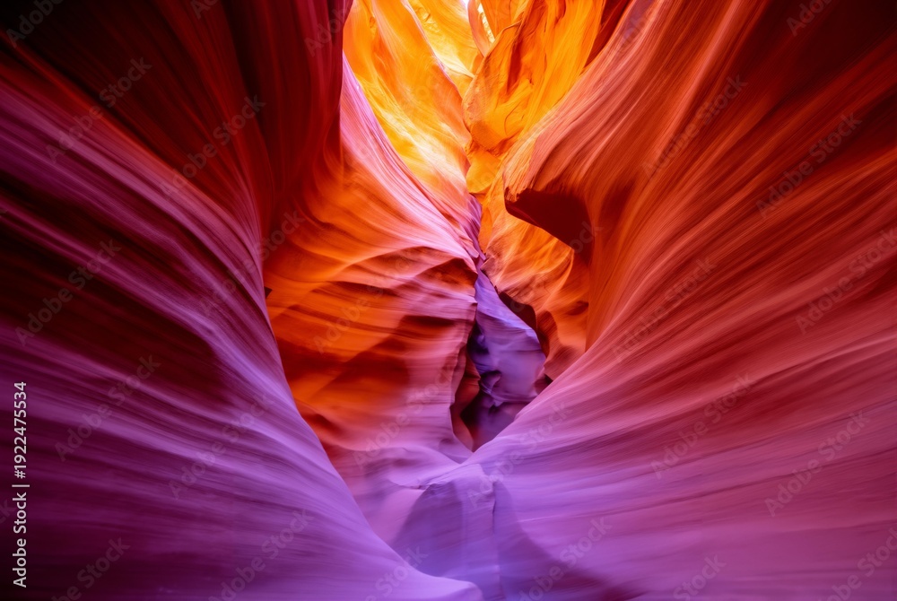 Obraz premium Dramatic canyon landscape with vibrant red rock formations and warm sunlight