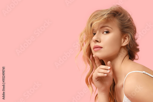 Blonde young woman with bea...