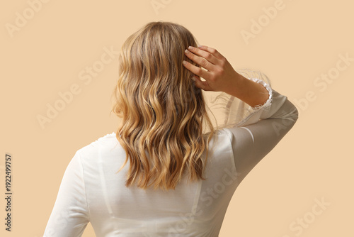 Blonde young woman with cur...
