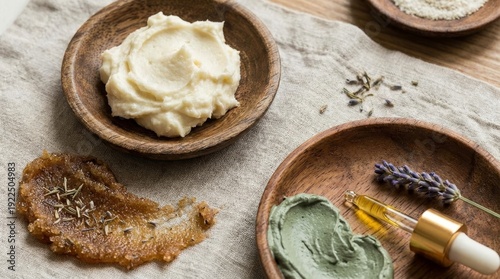 Natural skincare flat lay with clay mask, body scrub, cream and lavender essential oil, handmade plant-based products in wooden bowls for spa, wellness and relaxation rituals