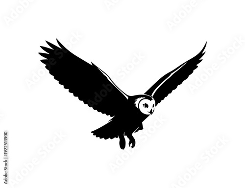 Majestic owl in flight, black silhouette with white face