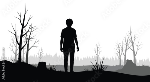 A lone figure stands amidst bare trees a striking silhouette