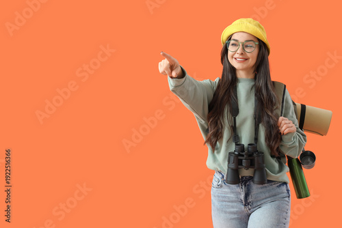 Female guide pointing at so...