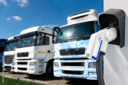 Wallpaper Mural Electric vehicles charging station on a background of a trucks Torontodigital.ca