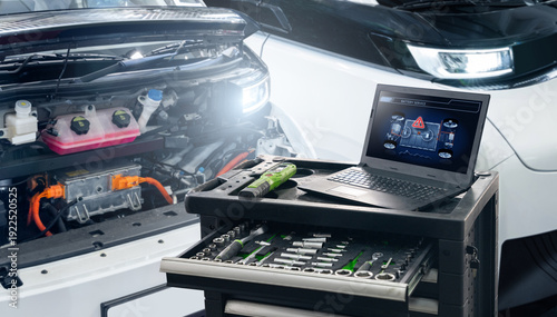 Wallpaper Mural Checking the battery pack of an electric car at a service center Torontodigital.ca
