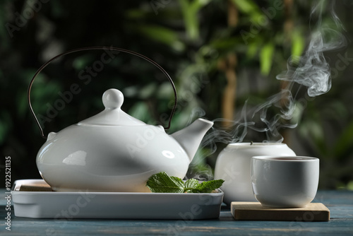 Tray with teapot, cup of ho...