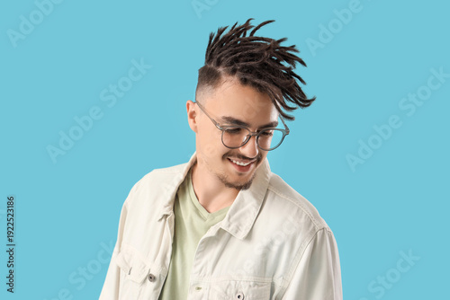 Young man with dreadlocks a...