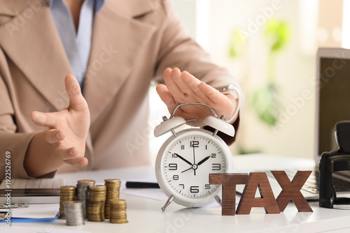 Businesswoman with alarm cl...