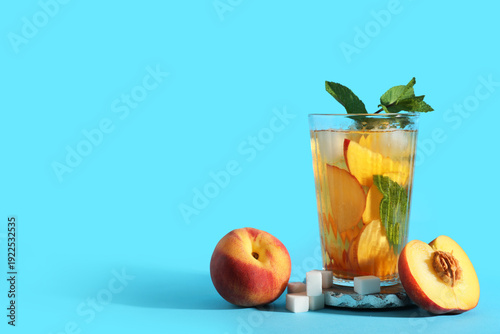 Glass of tasty peach iced t...