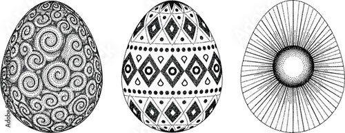 Three beautifully decorated eggs with intricate black and white designs