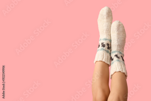 Legs of young woman in knit...