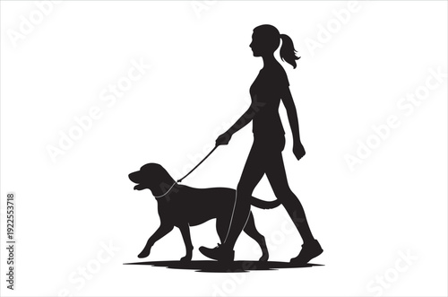 a woman walking her dog on a leash