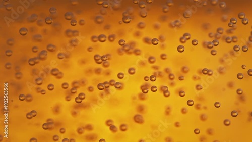 Air Bubbles Moving In Orange Liquid - Light Beer In Macro And Slow Motion